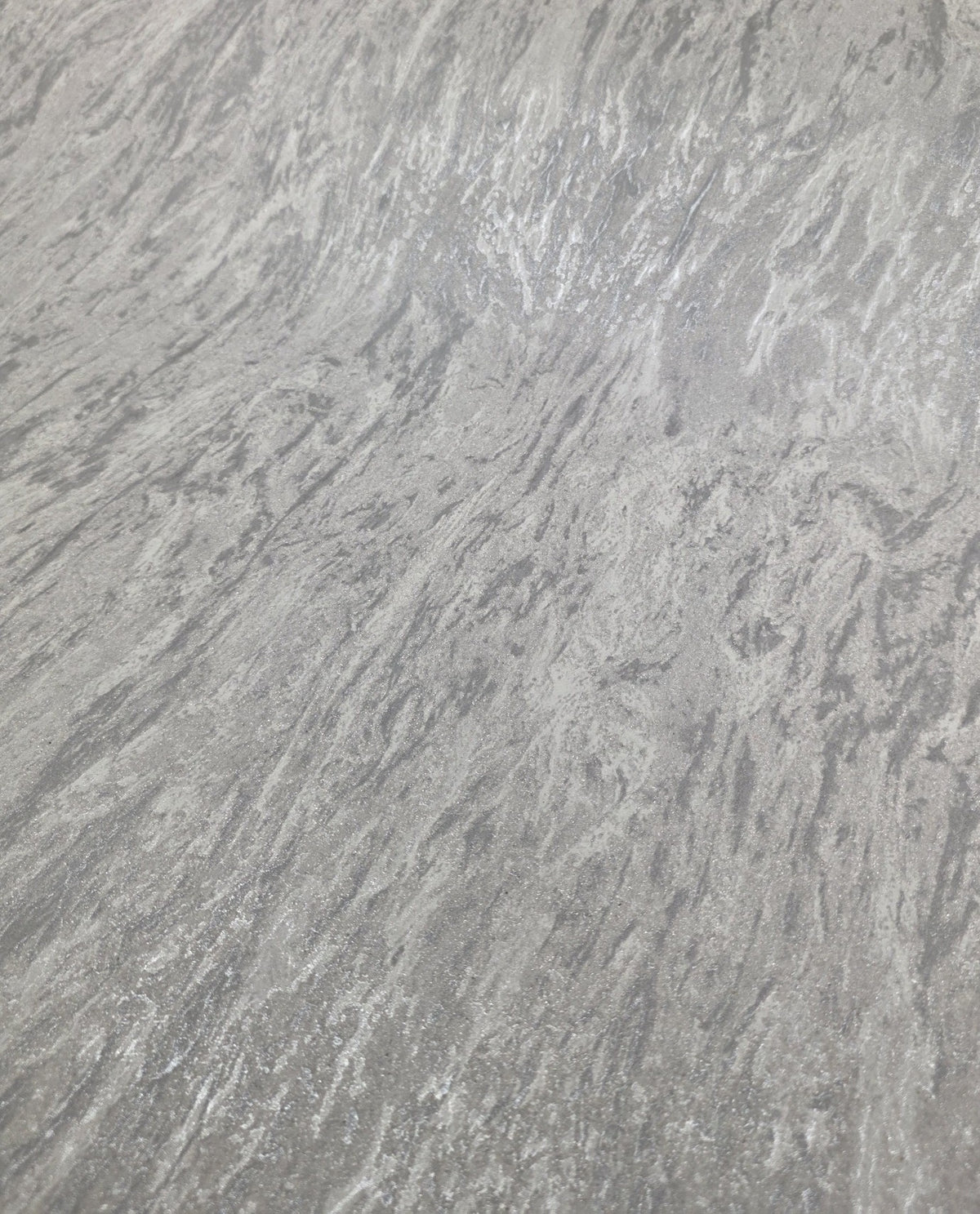 Marble Mist Glacier Blue SZT-0440, detail in raking light, showing the pearl sheen and stone-like texture